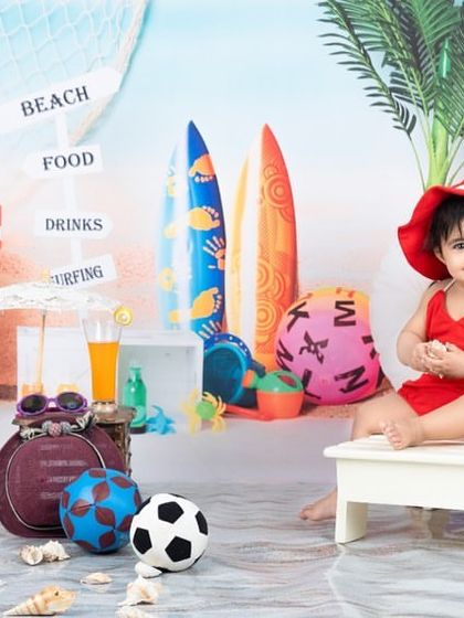 This little lady is ready for a day at the beach in her cute red swimsuit and hat.