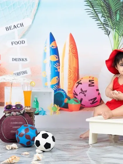This little lady is ready for a day at the beach in her cute red swimsuit and hat.