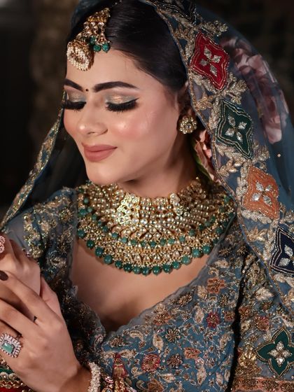 A detailed close-up of the eye makeup and the beautiful kundan necklace.