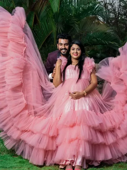 Celebrate your journey to motherhood with our special collection of maternity photoshoot gowns. This dramatic pink ruffled gown is designed for comfort and style, ensuring you get those breathtaking shots you've always dreamed of.