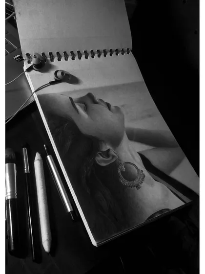 The same portrait, shown with my tools. The earphones show that music is a big part of my process, helping me focus for hours.