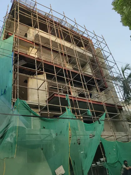 The same CR Park building during the construction phase, wrapped in scaffolding. This shows the transition from the structural frame to the finished facade, a process we manage with meticulous attention to detail.