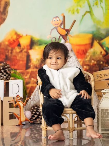 A calm moment in his panda suit. We create a comfortable environment so even the most active little ones feel relaxed during their shoot.