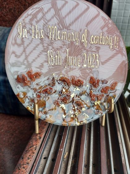 The way light hits the resin shows the different textures and layers within the memorial plaque. Each piece is handmade and has its own unique character, just like the memories it holds.