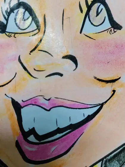 A close-up of a color caricature, showing the blending of colors on the cheeks and lips.