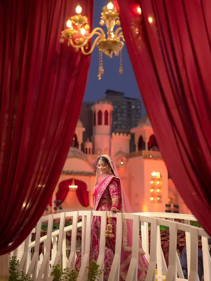 A dreamy, cinematic shot of the bride at her grand wedding.