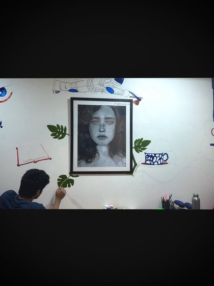 A wide shot of the wall mural in progress. I