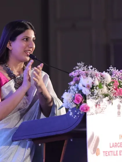 Speaking at the podium during the Global Textile Expo announcement. My delivery is always tailored to the event's specific audience, in this case, a mix of industry professionals and government representatives.