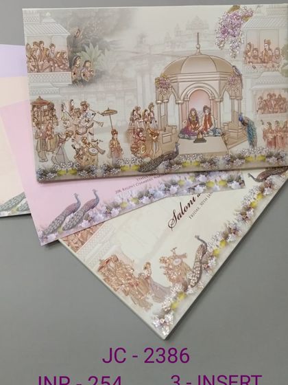This panoramic invitation illustrates a complete wedding scene, from the pheras to the celebratory procession. The card comes with three inserts and is rich in traditional details and color.