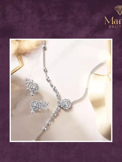 Explore our signature pieces that blend tradition with modern artistry. This delicate floral diamond set includes a necklace, bracelet, and earrings for a complete, coordinated look.