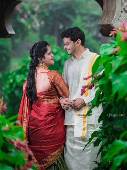 A beautiful pre-wedding shoot at Elements Bangalore, where the couple's traditional South Indian attire is perfectly framed by lush greenery and classic architecture.
