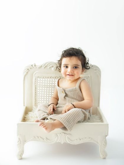 Seated like a little queen on her throne. This vintage inspired prop chair adds a touch of elegance to the sitter session while maintaining a clean and simple aesthetic.