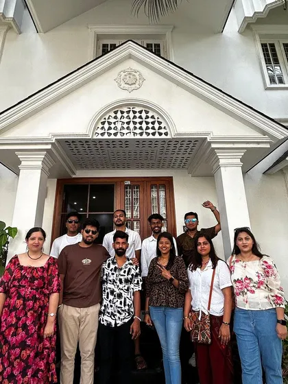 Our group in front of a beautiful white villa, our stay during the Varkala trip.