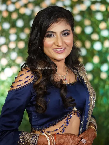 A full-frontal view of the glamorous reception makeup. The combination of a bold eye and a neutral lip is a timeless choice for any evening event.
