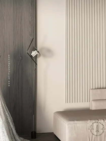 Our ceiling-to-floor light installation is shown here in a contemporary living space. Its slender, sculptural form adds an artistic element next to the sofa, providing a unique source of ambient light.