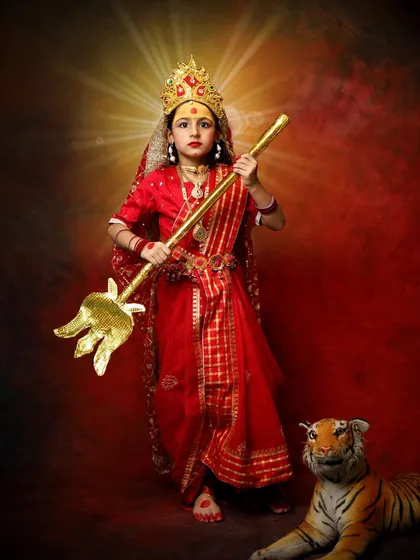 A powerful portrait of my daughter Hezal dressed as Maa Durga for Navratri. We created this divine look to honor the strength and wisdom of the goddess.