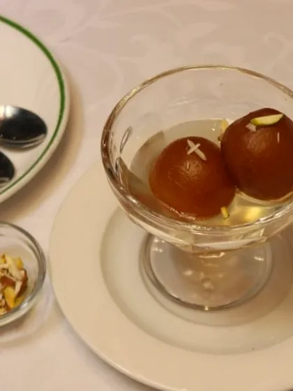 No meal is complete without a sweet ending. Our Gulab Jamun, soft and soaked in fragrant syrup, is the perfect traditional dessert to satisfy your sweet cravings.