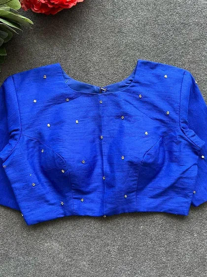 Another view of the front of the royal blue Elzara silk blouse.