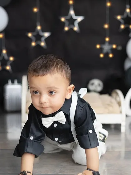A dapper little gentleman is turning one! This black and white themed shoot with stars is so chic and modern.