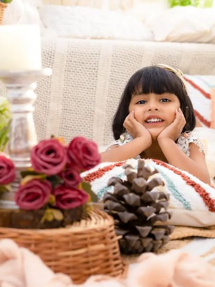 A smile is happiness you'll find right under your nose. This little girl's sweet, content expression is perfectly captured in this cozy, rustic setting.