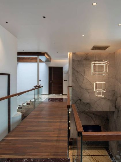 The modernization of an estate bungalow in Sakleshpur, captured at dusk. We worked to preserve the traditional character with its sloping tiled roof while opening up the space to connect with the lush estate grounds.