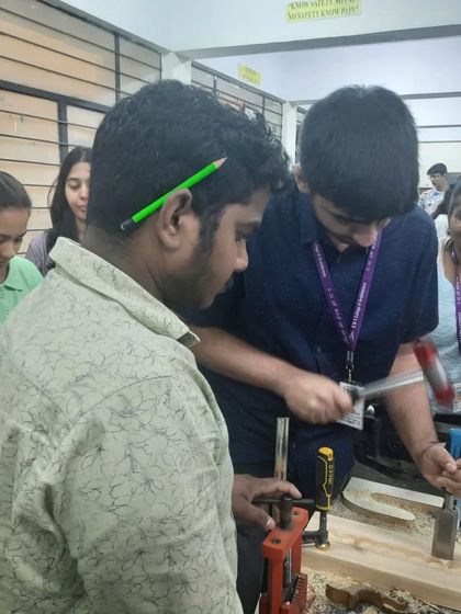 Guiding a student on the proper technique for using a chisel and mallet. Safety and correct form are the first things I teach.