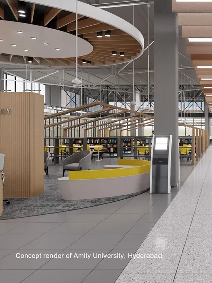 A concept render of the library at Amity University, Hyderabad. The design has an industrial feel with an exposed truss ceiling, balanced by warm wood tones and modern furniture, creating a spacious and agile learning environment.