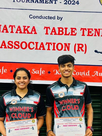 Champions Kushi V and Aakash KJ with their merit certificates after winning the Women's and Men's singles titles at the 1st State Karnataka State Ranking 2024.