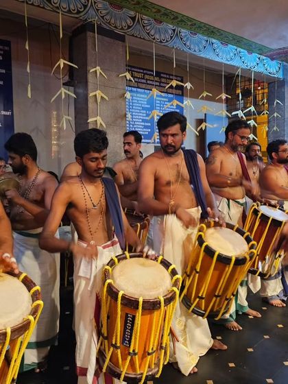Young and senior artists stand side by side, performing with unified devotion during the Mandala Masam festival celebrations.