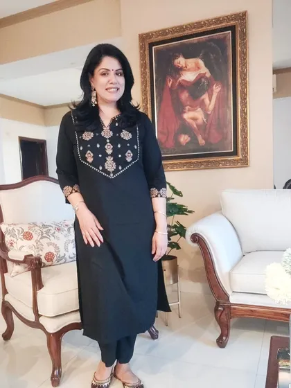 This comfortable black kurta set is a go-to for me. The heavy embroidery on the neckline means it doesn't need a necklace, showing how the outfit itself can be the main focus. I guide my clients on how to accessorize smartly to complement, not overpower, their clothes.