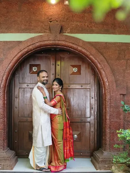 Another beautiful portrait in front of the ornate door, this time with a slightly different pose that feels both formal and affectionate.