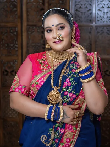 This look showcases a perfect balance of bold colors in the outfit with elegant, timeless makeup and jewelry.