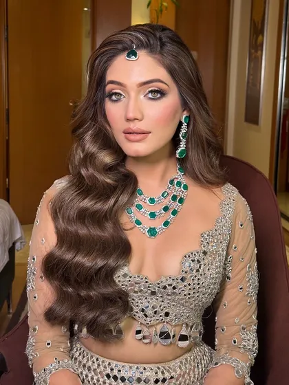 A close up of the final look. The deep side part and structured waves create a very dramatic and high fashion feel.