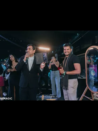 Our co-founder with chef Sanjeev Kapoor at the India Gourmet Luxe event, showcasing one of our instant prints. This demonstrates the immediate, tangible value we bring to any event.
