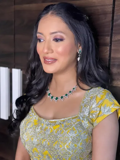 A close-up of Riddhi's makeup. The soft purple eyeshadow makes her eyes pop and adds a unique touch to the look.