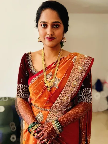 For pre-wedding rituals, a natural look is often best. This close-up shows my approach to creating a flawless, natural makeup base that enhances features without feeling heavy, paired with an elegant updo.