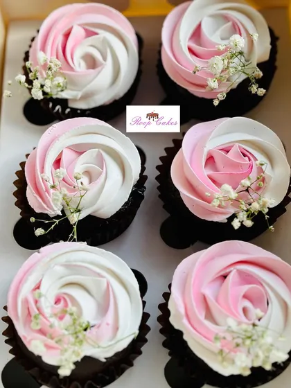 A beautiful set of cupcakes for a bride-to-be. I created these elegant two-toned frosting roses in pink and white on rich chocolate cupcakes, and finished them with a delicate sprig of baby's breath.