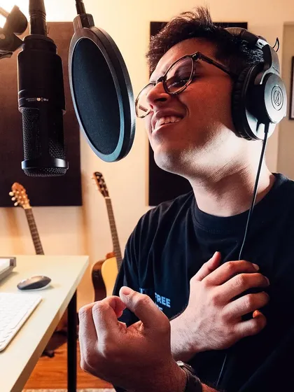Lost in the music. This is a candid shot from my home studio during a vocal recording session. For me, it's all about pouring real emotion into every take to make sure the song feels honest and true.