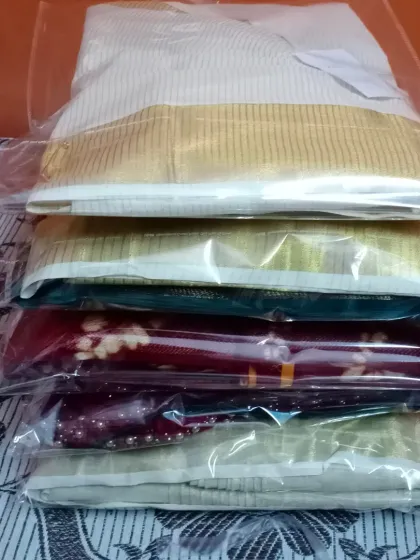 A stack of sarees, all pleated, packed, and ready to go back to a happy repeat client. I take pride in being a trusted partner for women who want to look their best for every occasion, big or small.