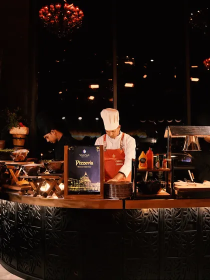 Welcome to our live Pizzeria station, where our chef crafts fresh, hot pizzas to order, bringing a taste of Italy to your celebration.