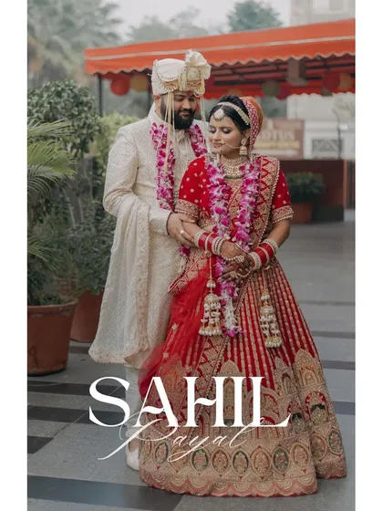 A classic portrait of Sahil and Payal, her red lehenga complementing his white sherwani perfectly.