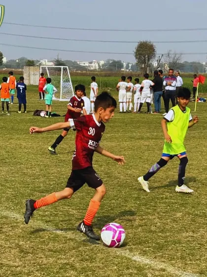 A player from our U-10 team dribbles down the sideline, looking to create a scoring opportunity during a tournament match.