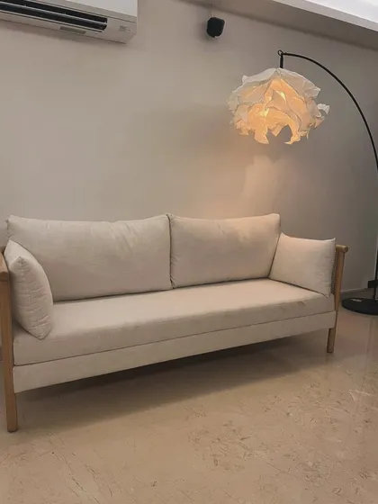 Full view of the minimalist oak sofa, perfect for contemporary living rooms.