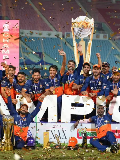Another angle of the UPT20 championship celebration, showing the players' excitement amidst the falling gold confetti. Capturing multiple perspectives ensures a complete story of the win.