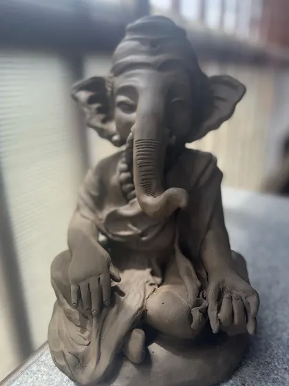 The lighting in the studio catching the beautiful form of this Ganesha idol I sculpted. It's a moment of peace and happiness.