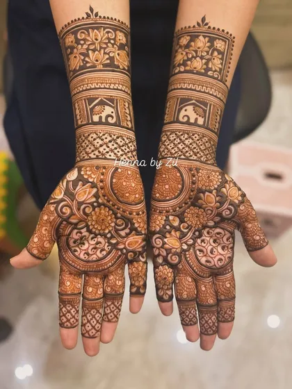 A beautiful design featuring a mix of floral mandalas and elephant motifs, perfect for a traditional bride.