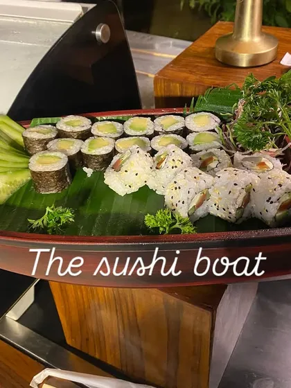 The Sushi Boat is one of our most popular international offerings. Freshly made sushi rolls, including avocado maki and other varieties, are artfully arranged on a wooden boat, creating a visually impressive display.