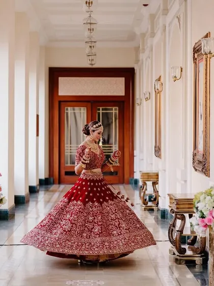 A bride's joyful twirl in the grand corridor of a palace hotel. This portrait captures the elegance, excitement, and fairytale feeling of her wedding day.