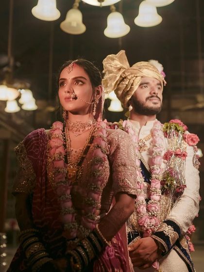 A powerful shot of the couple during the ceremony. The bride's makeup is designed to look flawless from every angle.