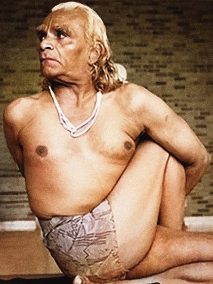 A classic photograph of Guruji B.K.S. Iyengar in a deep twist. His life was a testament to the transformative power of yoga, which he described as a ferry from the bank of ignorance to the shore of knowledge.
